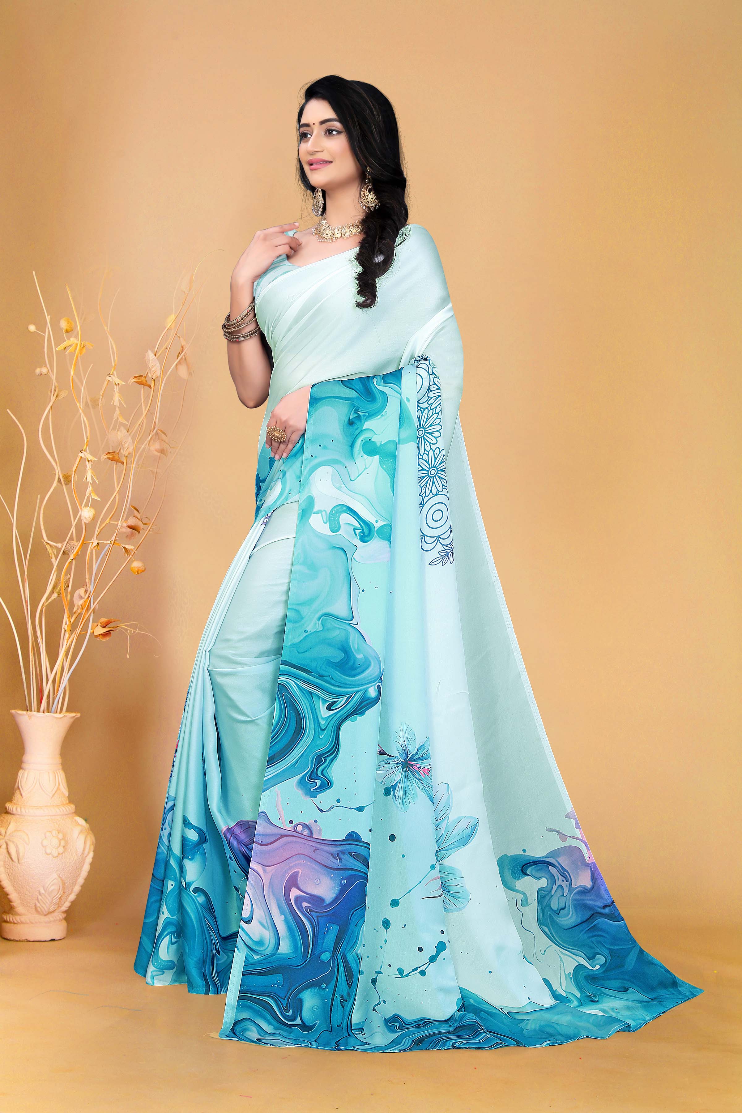 Soothing Aqua Blue Saree with Marble Print and Floral Accents for a Contemporary Ethnic Statement Look