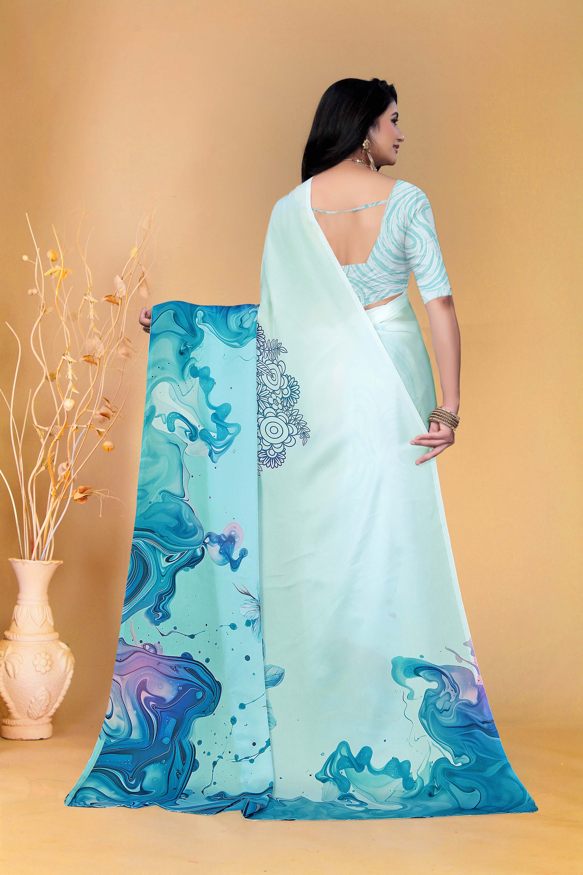 Soothing Aqua Blue Saree with Marble Print and Floral Accents for a Contemporary Ethnic Statement Look