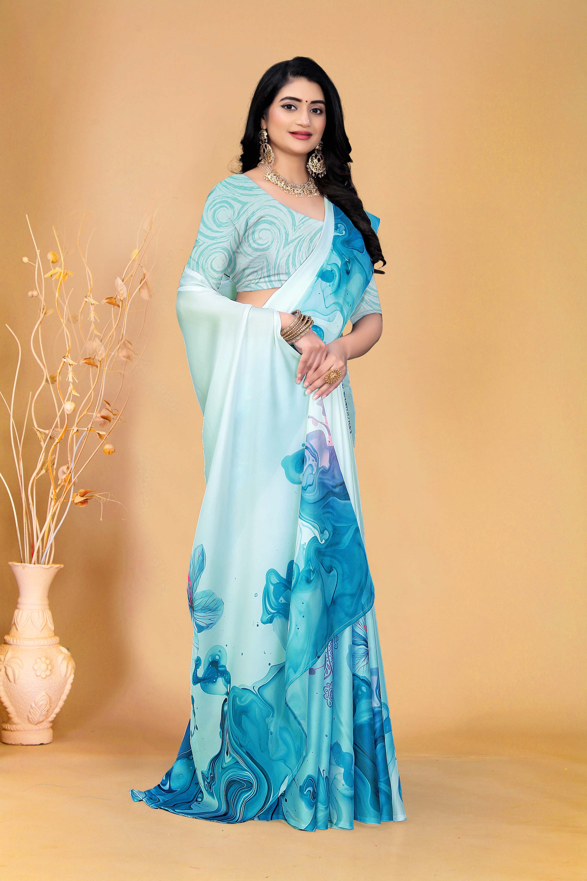 Soothing Aqua Blue Saree with Marble Print and Floral Accents for a Contemporary Ethnic Statement Look