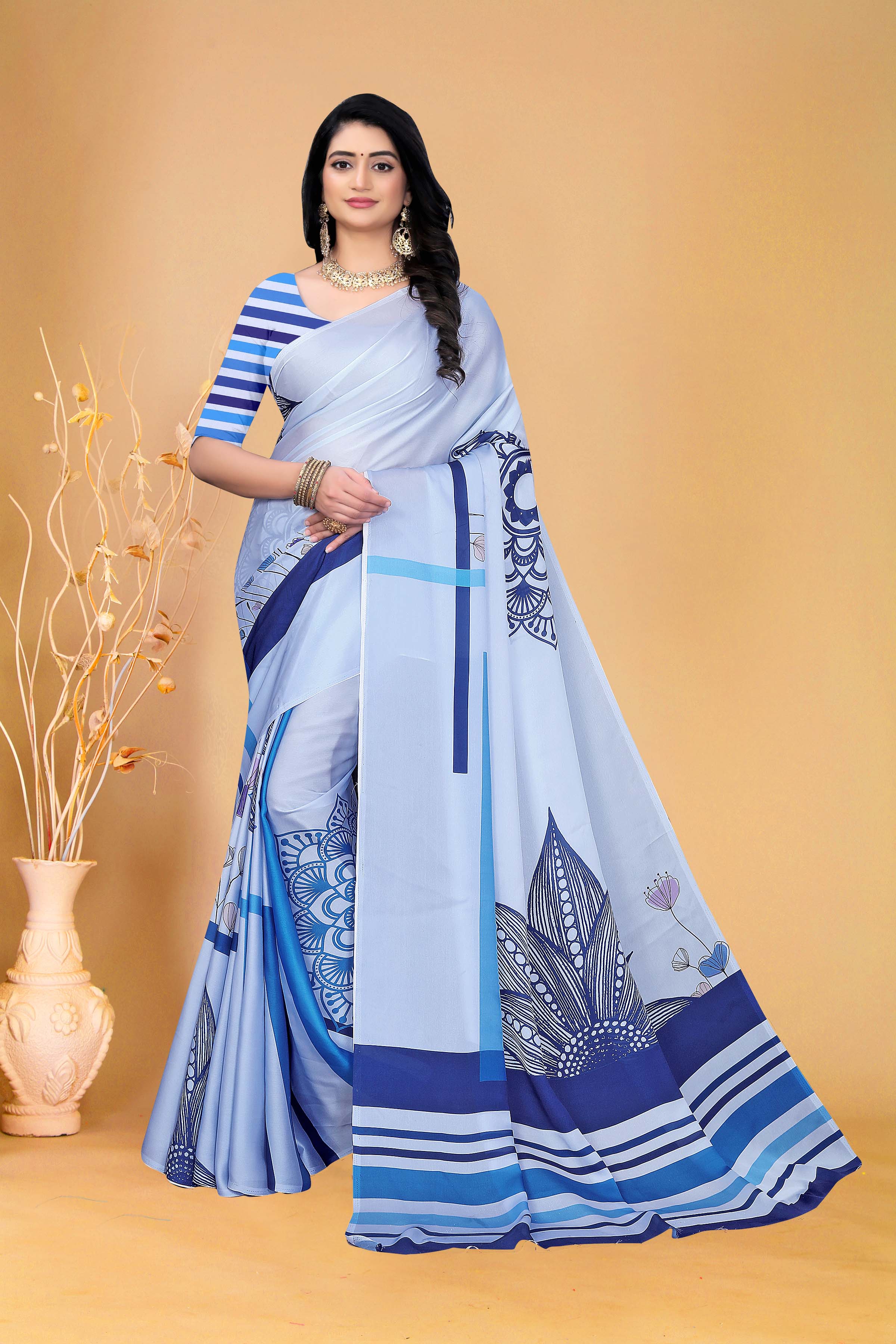 Graceful Sky Blue Printed Saree with Contemporary Striped Blouse