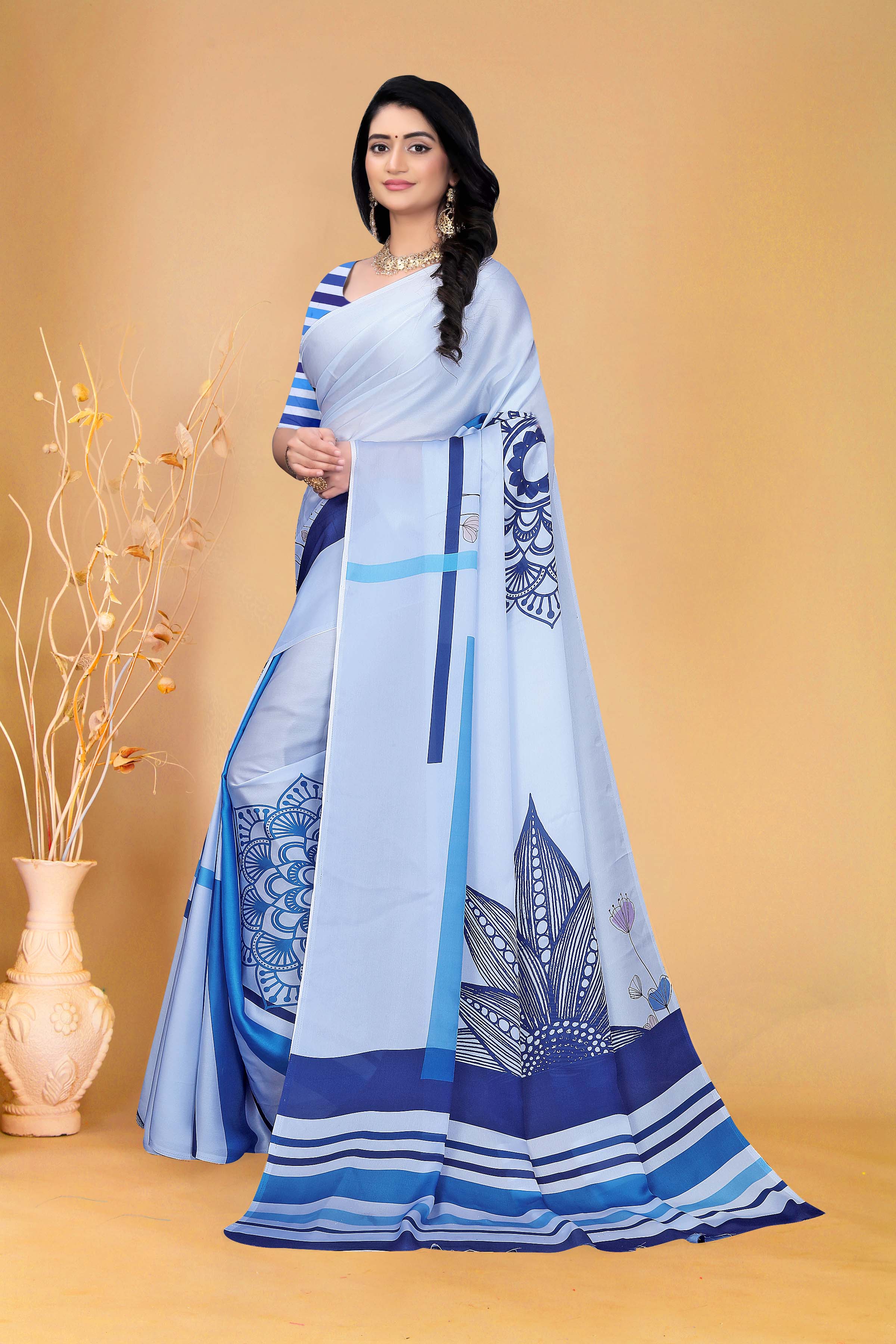 Graceful Sky Blue Printed Saree with Contemporary Striped Blouse