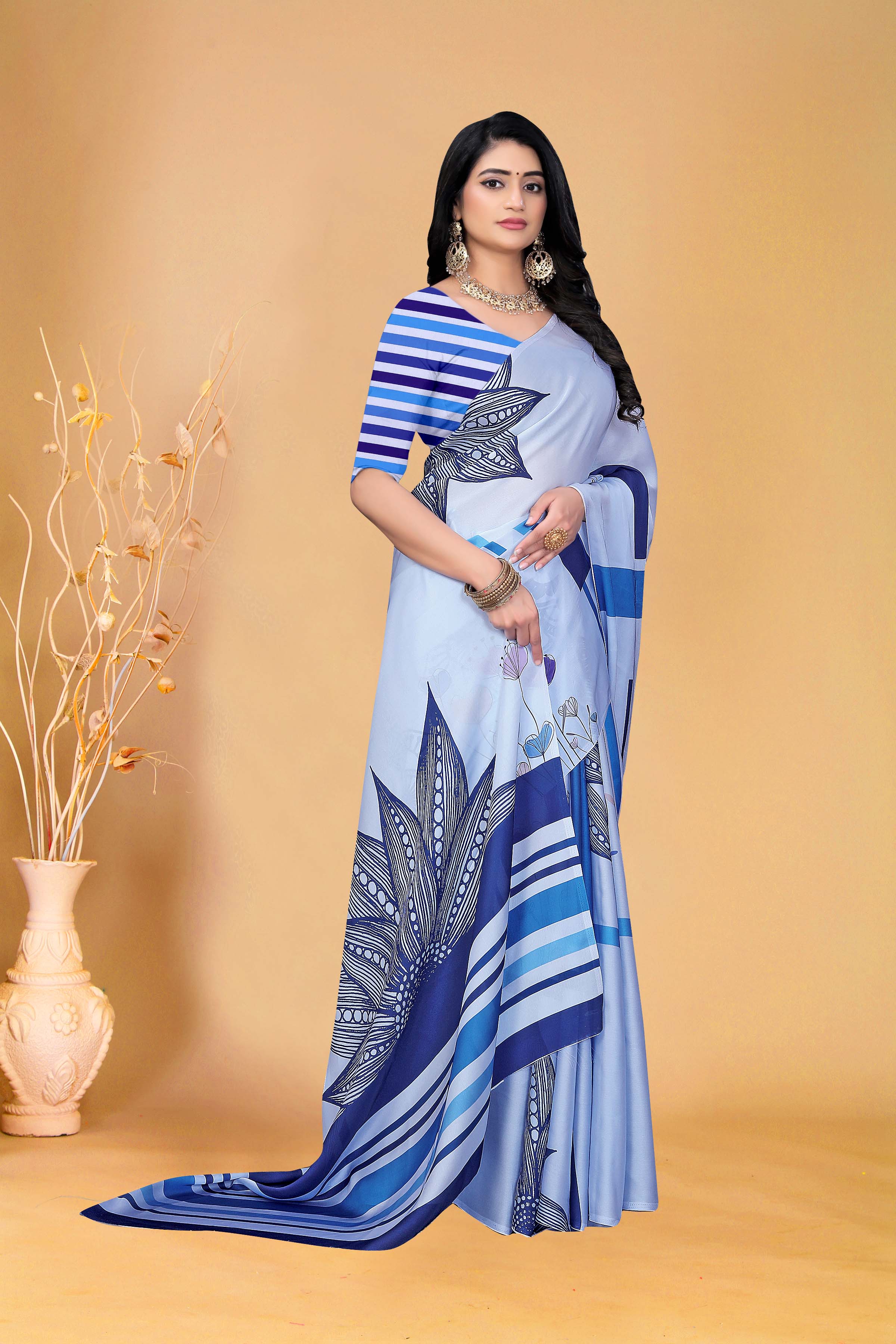 Graceful Sky Blue Printed Saree with Contemporary Striped Blouse