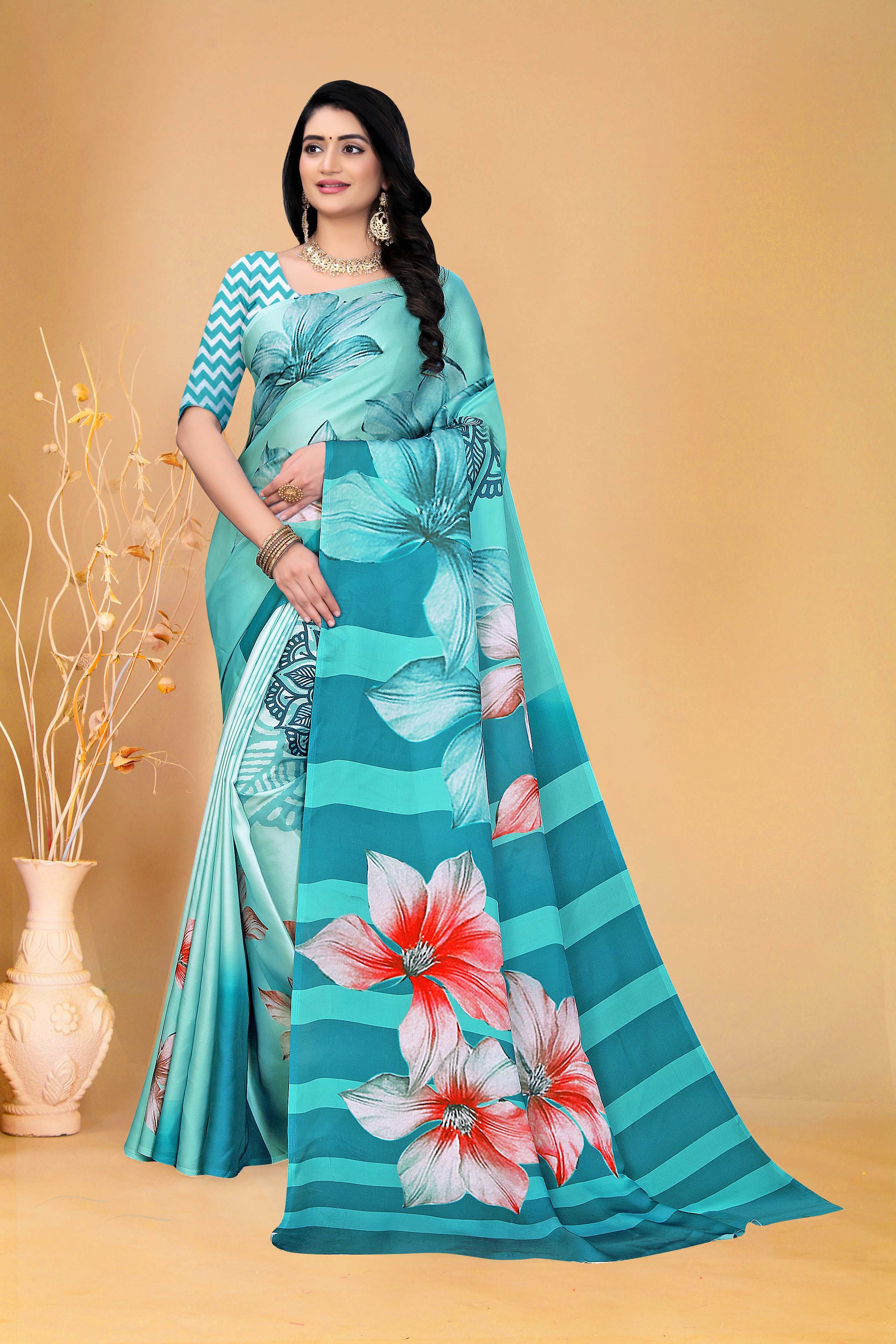 Elegant Teal Floral Saree with Zigzag Blouse Design