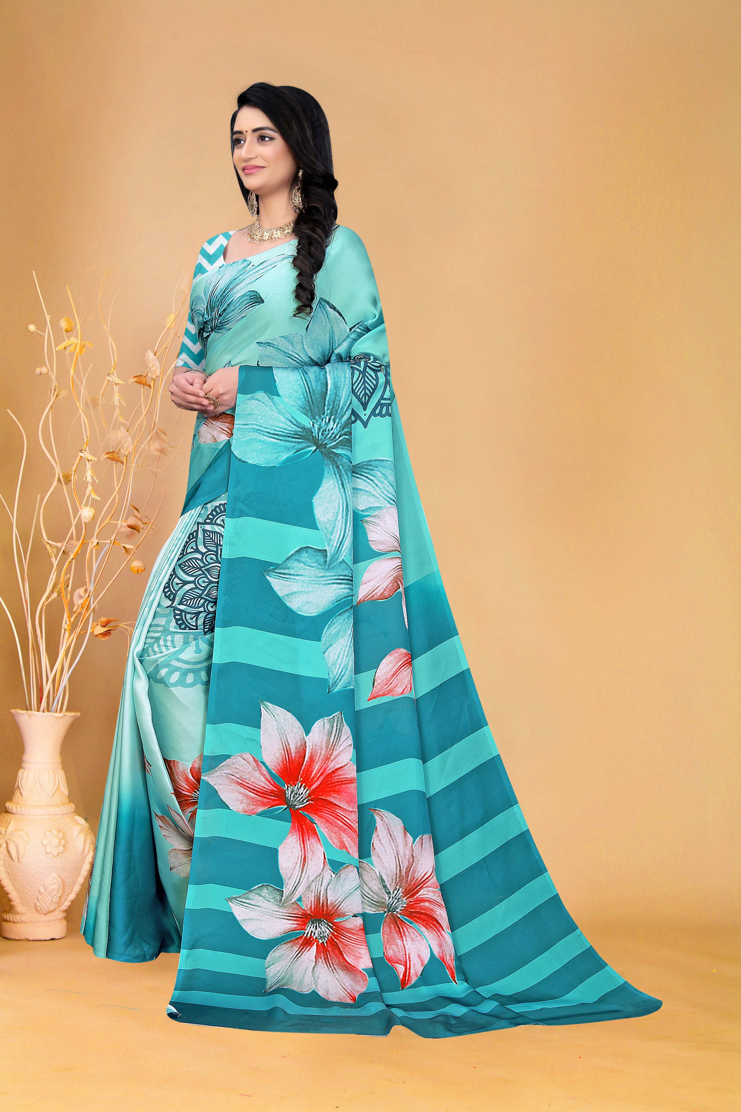 Elegant Teal Floral Saree with Zigzag Blouse Design