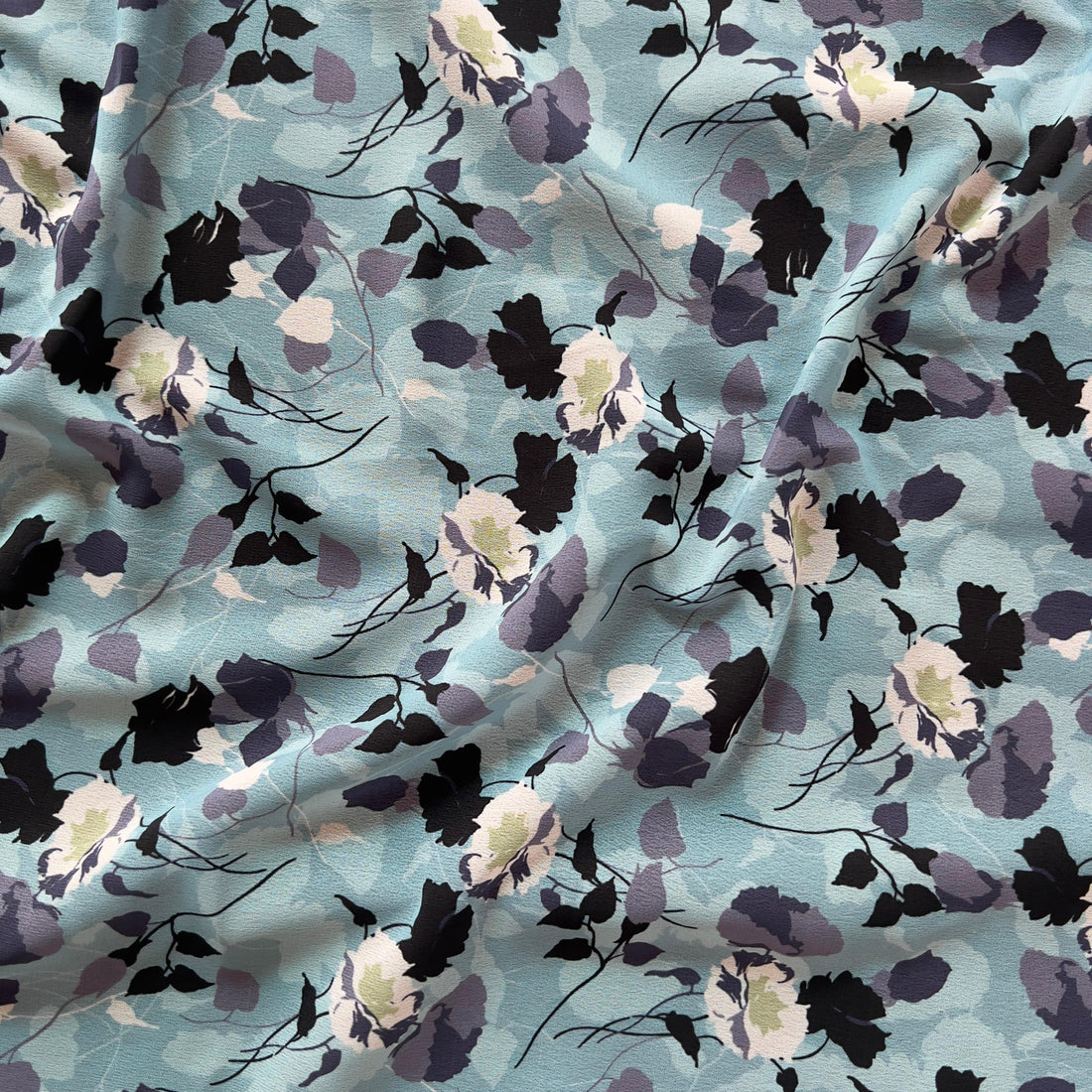 Overlapping blue floral design on georgette